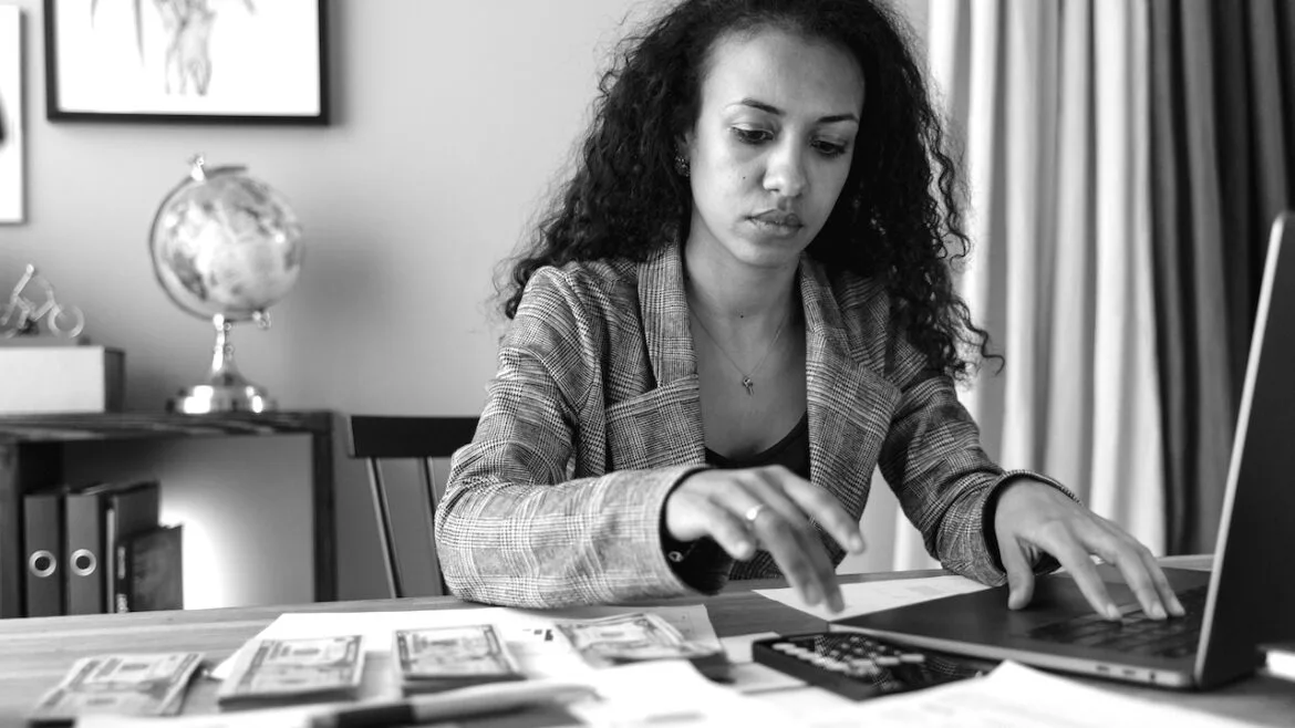 Woman adds up money